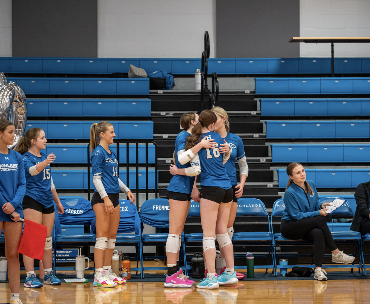 Lyla Bottom (12) hugs Ella Cox (12) during their senior night game at Highlands. 
